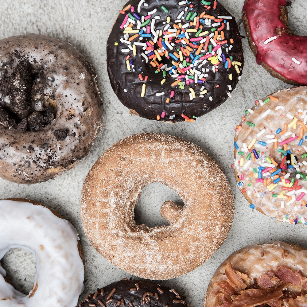 A photo of a bunch of Olivers Donuts together promoting catering