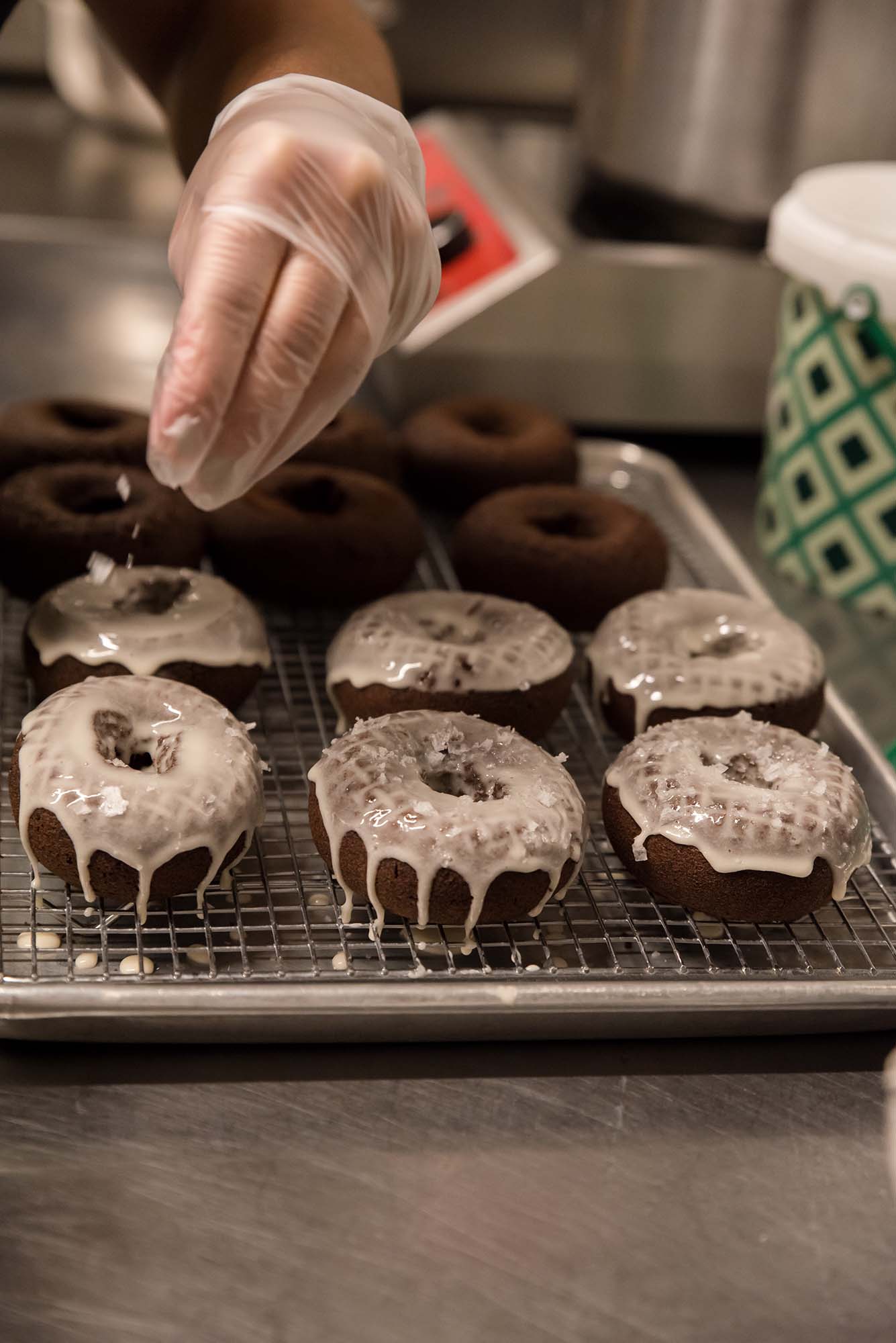 fresh chocolate donut making at Oliver's Donuts