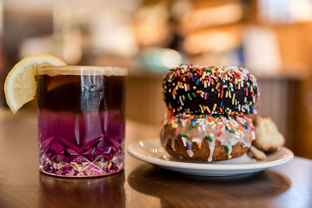 a photo of oliver's donuts and a speciality coffee drink served at Oliver's